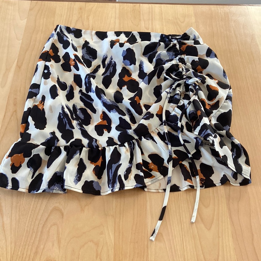Cheeta print skirt, worn once. Blue, black, brown, and cream. Good condition.